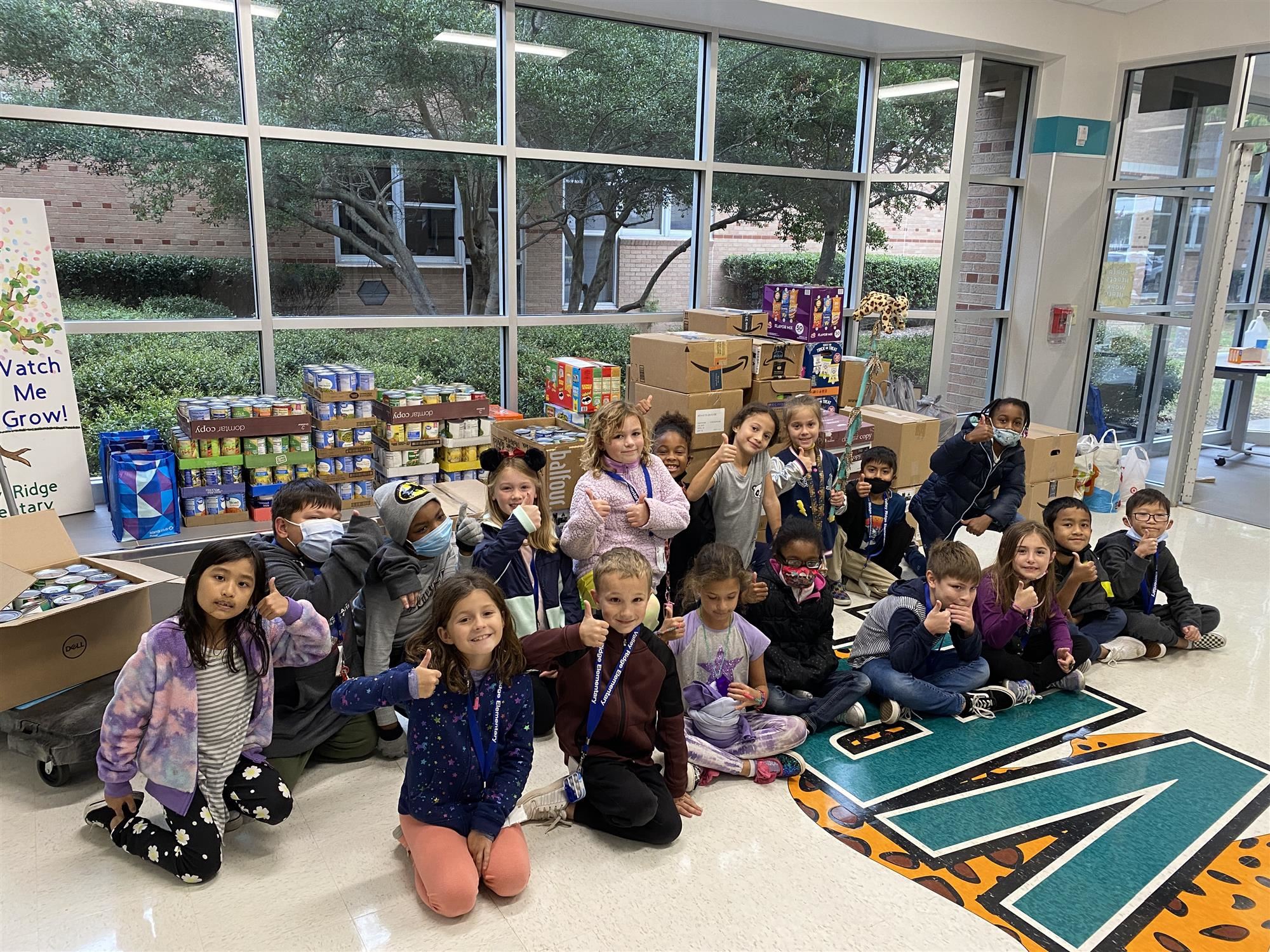 Students collect food for 2021 Stuff the Pantry Drive. 